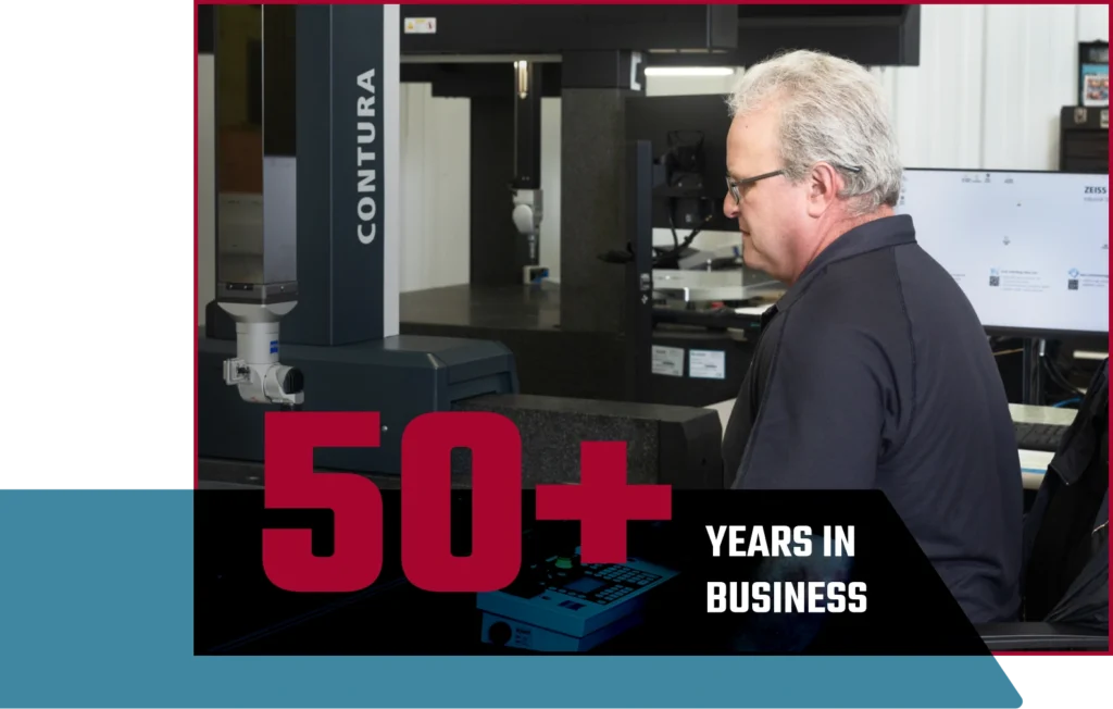 About 13 A man working in a CNC manufacturing shop with text "50+ Years in Business" on top.